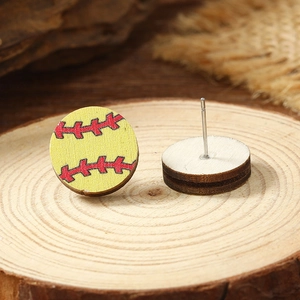 Close-up of wooden softball stud earrings showing yellow front and natural wood texture