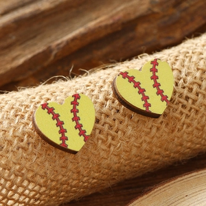 Minimalist heart-shaped wooden stud earrings with a yellow softball pattern on a burlap base