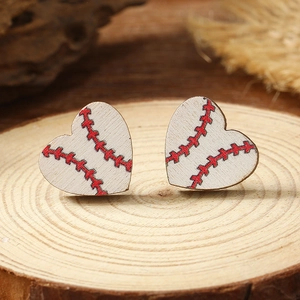 Detailed close-up of heart-shaped wooden baseball earrings with red stitch texture