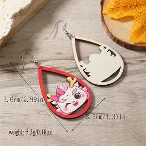 Detailed view of wood dragon drop earrings with pink cartoon design and measurement info