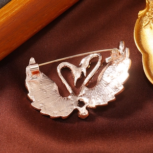 Macro shot of the durable metal safety pin clasp on the elegant heart-shaped brooch