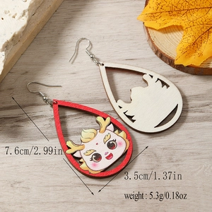 Detail of wooden dragon earrings with dimensions and weight displayed on wood background