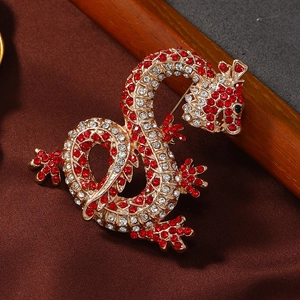 Luxurious Chinese dragon brooch with red and white rhinestones on golden alloy metal