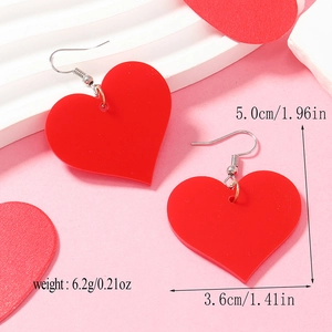 Detailed view of red acrylic heart earrings with dimensions showing 5.0cm length