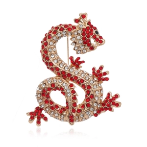 Luxurious Chinese dragon brooch with red and white crystals on a gold setting