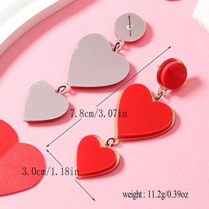 Detail view of heart drop earrings showing dimensions 7.8cm length and acrylic red finish