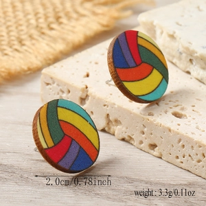 Detail view of round rainbow striped wooden earrings with 2cm diameter measurements