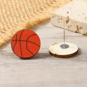 Detail view of basketball wood stud earrings with realistic texture and steel pins