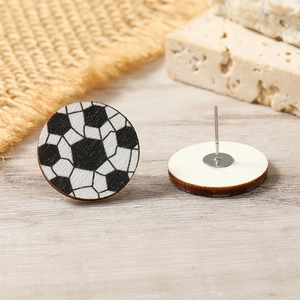 Detailed close-up of soccer pattern wooden stud earrings showing front and back texture