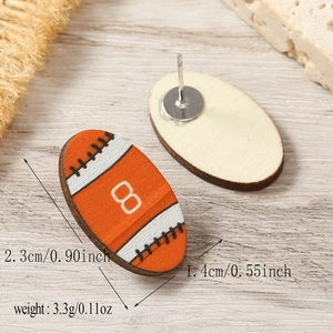 Macro shot showing front and back details of rugby-themed wooden stud earrings