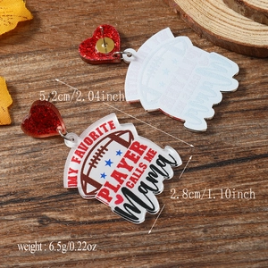 Detail of acrylic rugby earrings featuring red hearts and My Favorite Player slogan