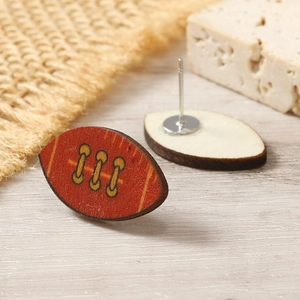 Detail view of American football wood earrings showing texture and metal stud backings