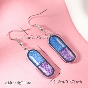 Detailed view of capsule earrings with blue and purple glitter acrylic showing dimensions