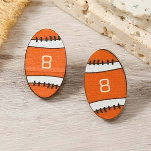 Detail of wooden rugby ball earrings with number 8 and classic sports stitch pattern