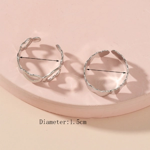 Detail view of 1.5cm diameter silver heart rings with adjustable open band design