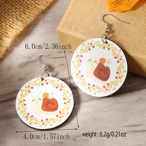 Detail shot of round wooden snail earrings showing 4.0cm diameter and 6.2g weight specs