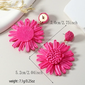 Macro view of rose pink raffia flower earrings with measurement size details