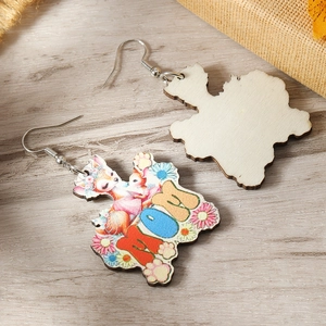 Macro detail of laser-cut wooden earrings with colorful MOM pattern and floral deer print