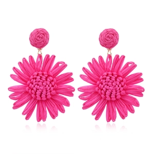 Bright pink raffia flower earrings in sunflower shape for summer beach vacation style