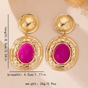 Detail view of vintage gold earrings with purple resin stones and size measurements