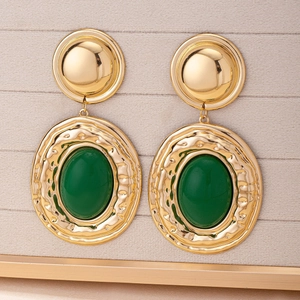 Vintage gold geometric drop earrings with green resin stone in bohemian palace style