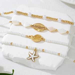 Conjunto de tobilleras de playa de verano con perlas blancas y dijes de estrellas