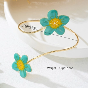 Gouden open armband met turquoise bloemen en een diameter van 8cm voor dames