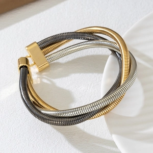 Bracelet multicouche en chaînes serpent or argent et gris avec fermoir doré poli