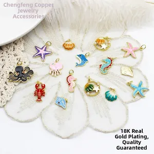Detail of 18K gold plated ocean animal charms with colorful enamel drip oil finish