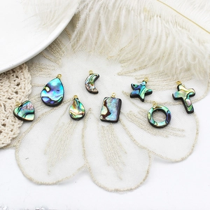 Natural abalone shell charms set with golden rings in heart and star geometric shapes