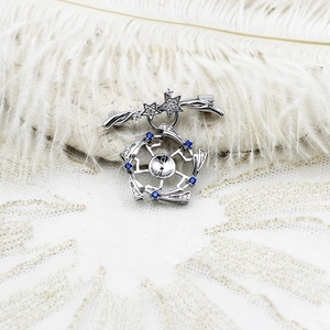 Luxury butterfly shell brooch with cubic zirconia and star-shaped silver finish accents