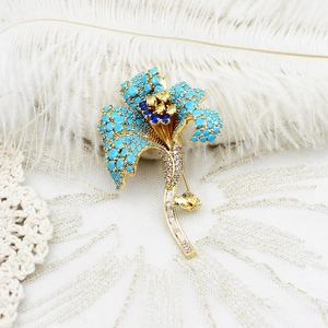 Elegant lily of the valley brooch in gold with blue stones and crystals for coats