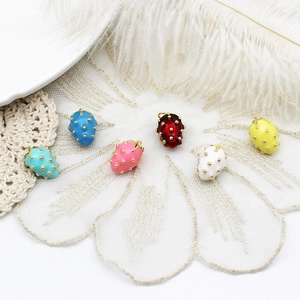 Detailed view of colorful strawberry charm pendants for DIY jewelry making accessories