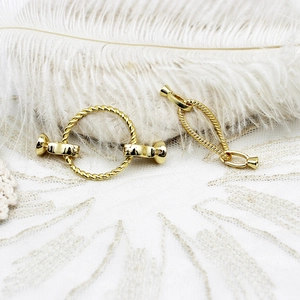 Detailed view of 18k gold plated textured round toggle clasps for jewelry making
