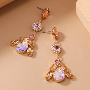 Detail of vintage style earrings with colorful crystals and gold-tone fringe design