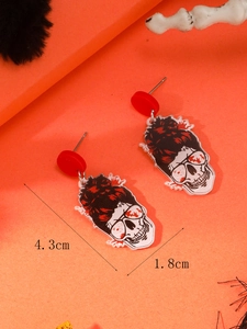 Detailed view of Halloween skull earrings with messy bun and sunglasses measuring 4.3cm