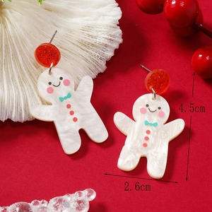 Detail of gingerbread man acrylic earring with size 4.5cm by 2.6cm and festive red theme