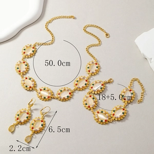 Floral pearl rhinestone jewelry set with gold necklace, bracelet and drop earrings