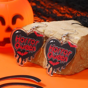 Halloween heart acrylic earrings with Horror Queen text on orange festive backdrop
