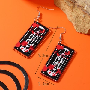 Detail view of retro VHS acrylic earrings with red blood splatter and dimensions of 7.3x2.4cm
