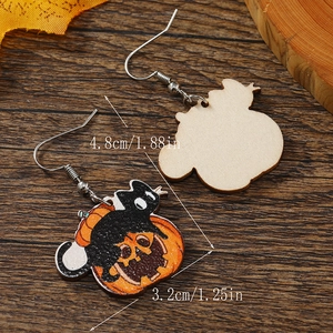 Detail view of wooden black cat and pumpkin Halloween earrings with size measurements