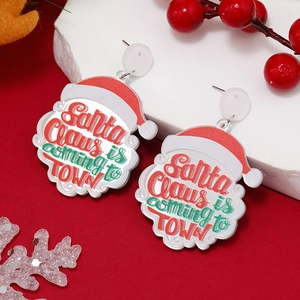 Christmas Santa Claus acrylic earrings with festive slogan on a red holiday backdrop