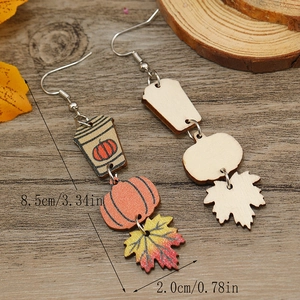 Detailed view of Halloween wood earrings with autumn leaves and pumpkin cups, 8.5cm length