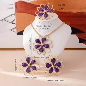 Exaggerated golden flower necklace earrings and ring set with purple enamel details