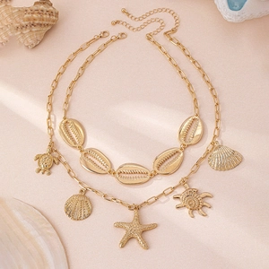 Collana a strati dorata con ciondoli a stella marina e conchiglie in stile marino lussuoso