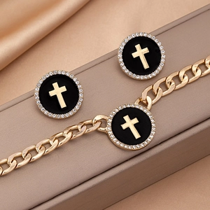 Golden Cuban chain bracelet and cross earrings set with black enamel and zircons