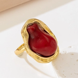 Vintage French baroque ring featuring gold lava texture and a red teardrop stone
