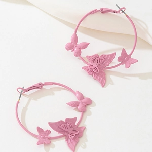Pink hoop earrings with three distinct 3D butterfly charms and a polished metallic finish