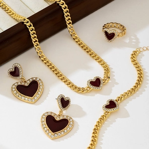 Elegant gold-plated jewelry set with burgundy enamel hearts and sparkling zircon accents