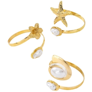 Three-piece gold metal beach armlet set featuring starfish, flower designs and baroque pearls